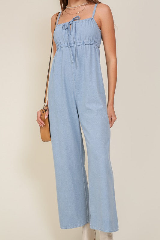DENIM BLUE SLEEVELESS JUMPSUIT WITH SELF FRONT TIE