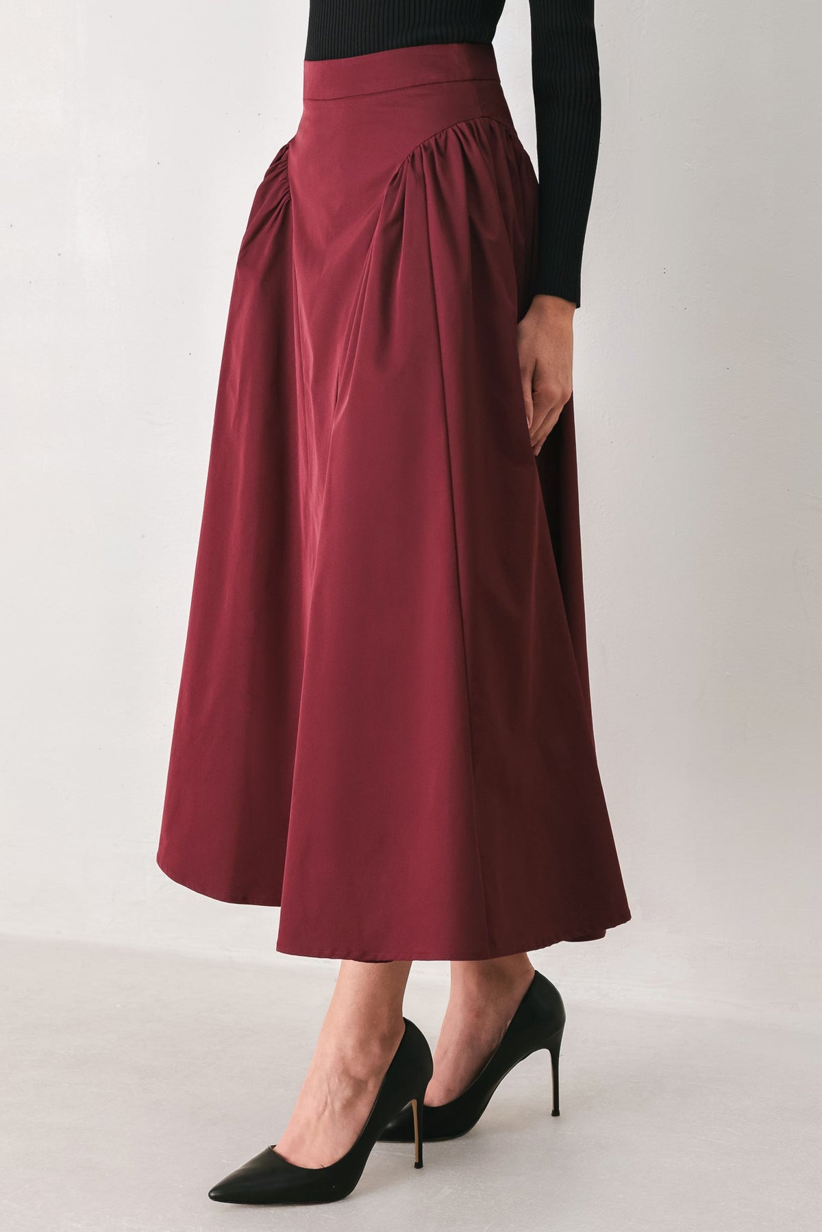 SCULPTED NOIR SHIRRED MIDI SKIRT