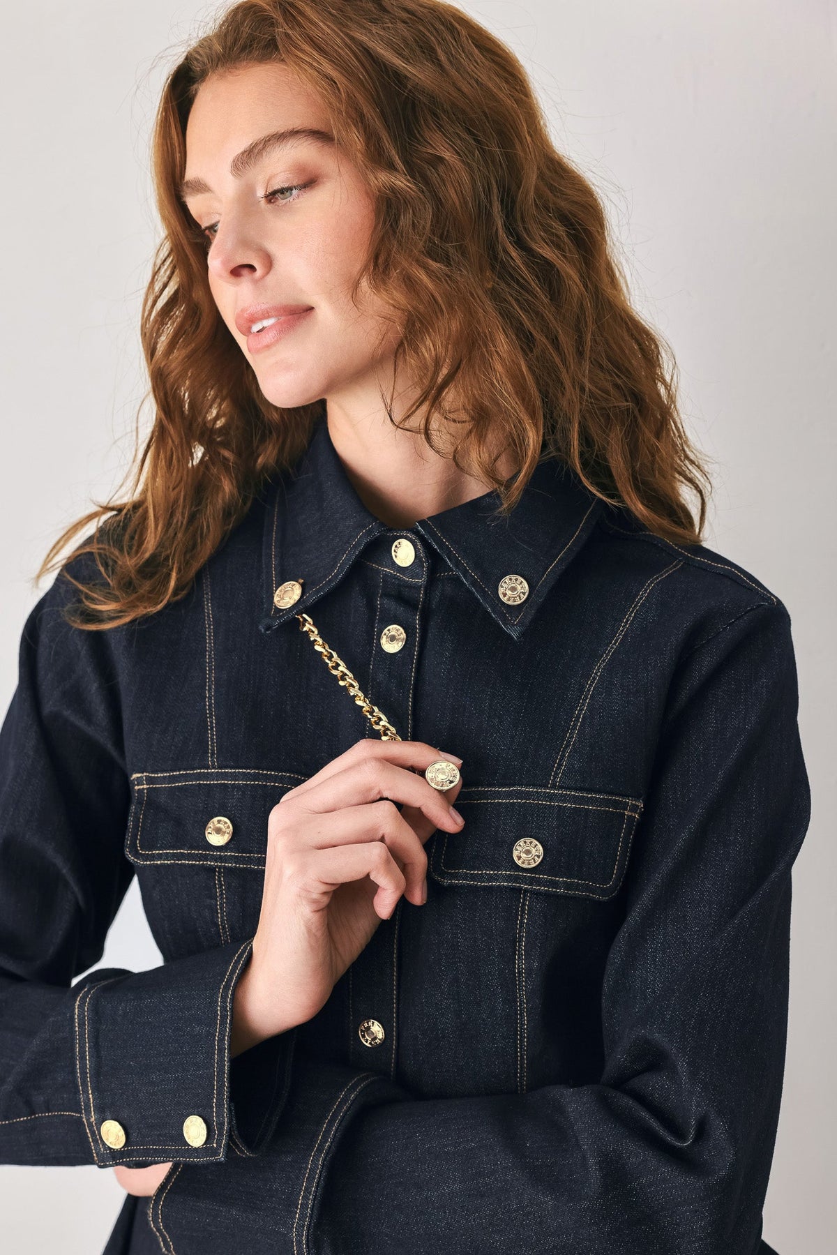 INDIGO ICON DARK INDIGO CHAIN-DETAIL PEPLUM DENIM TOP