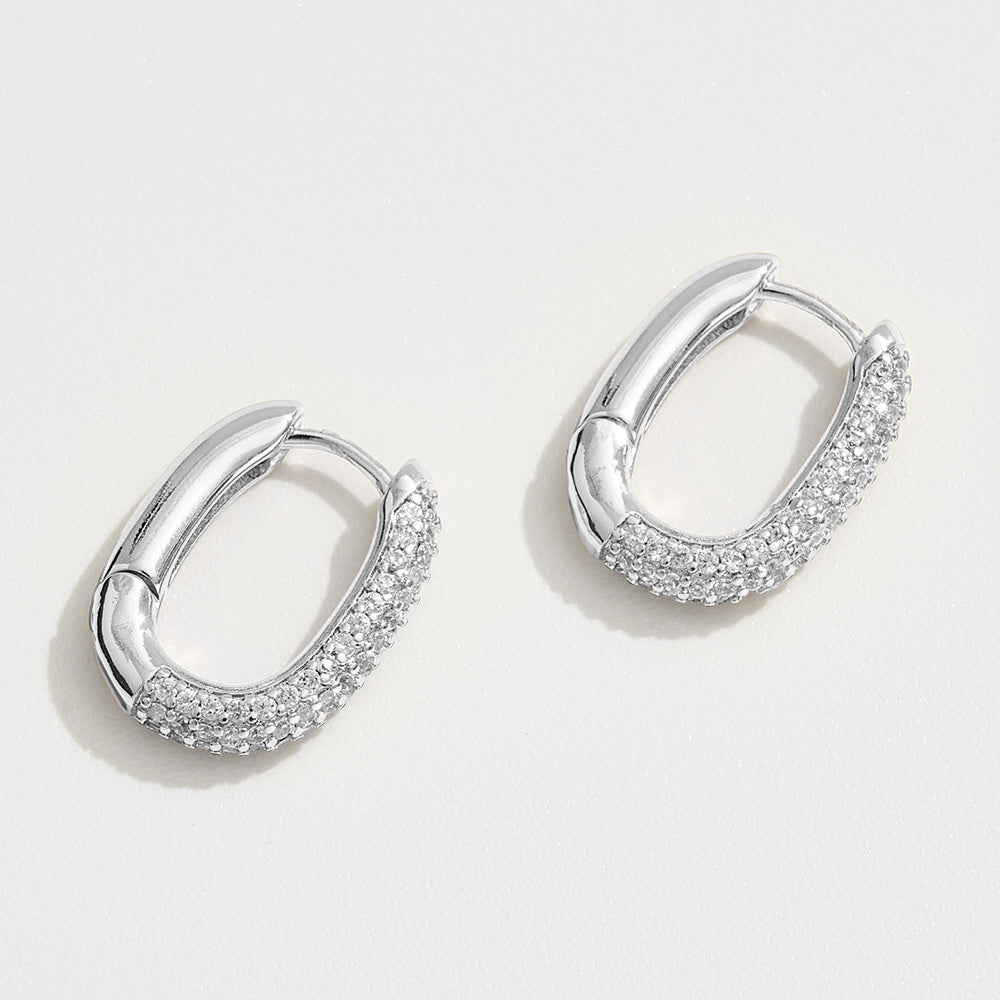White Gold Dipped CZ Stone Paved Oval Huggie Hoop Earrings